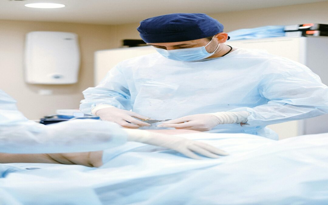 Medical Examiner Performing Autopsy Procedure In A Clinical Setting With Surgical Instruments.